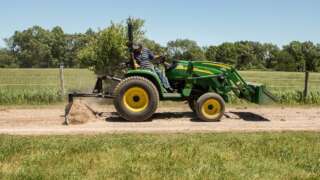 Tractor Towing ABI Attachments Rear Blade on Gravel Road