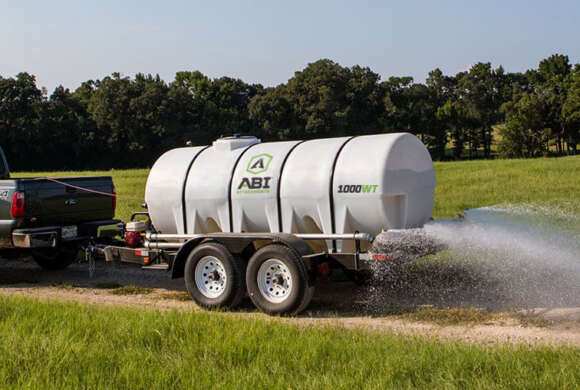 Truck Hauling 1000 Gallon Water Trailer Dust Abatement