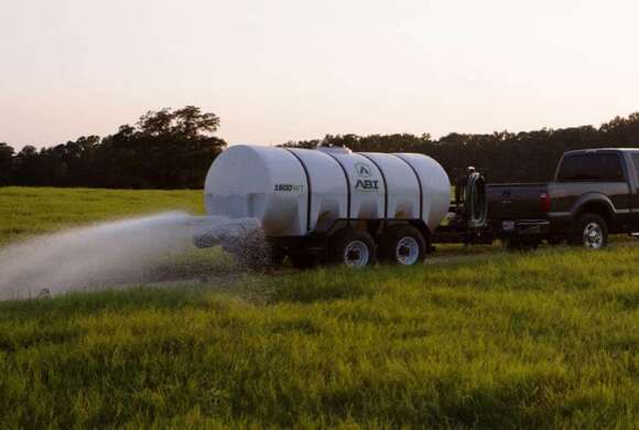 Truck Hauling 1600 Gallon DOT Water Trailer Dust Abatement