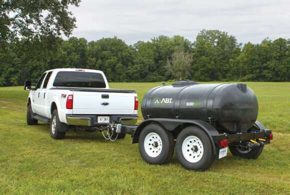 Truck Hauling Potable Water Trailer