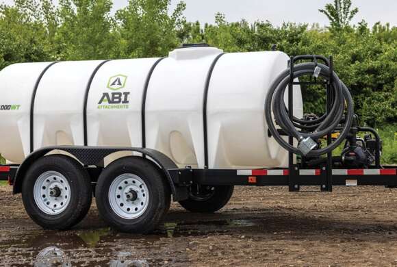 A sprayer trailer with a large tank attached, ready for agricultural use