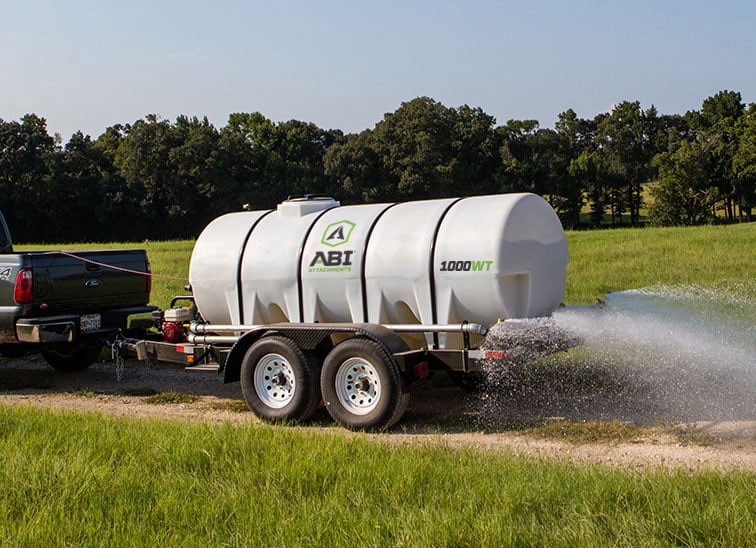 Truck Hauling 1000 Gallon Water Trailer Dust Abatement