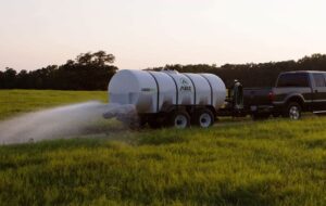 Truck Hauling 1600 Gallon DOT Water Trailer Dust Abatement