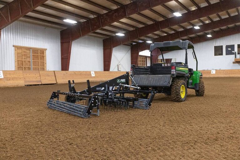 The SportPro M3 is in a large indoor synthetic footing arena. The view is from the back.