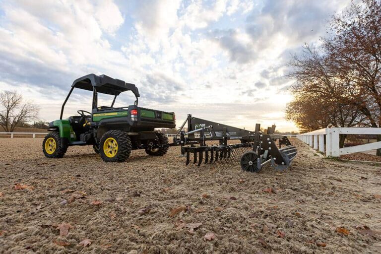 SportPro M3 being displayed outside in synthetic footing with surrounding fencing.