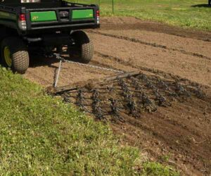 ABI ATV Chain Harrow in soil.