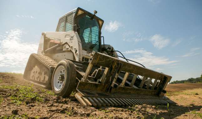 SR3 equipment attachment attached to a skid steer loader.