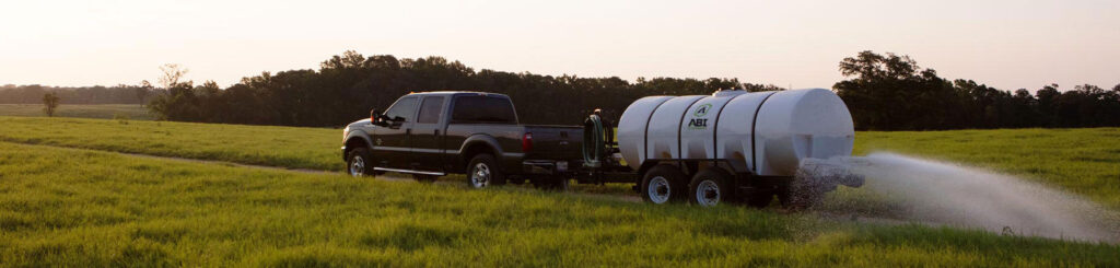 Truck attachments like a water trailer in use.