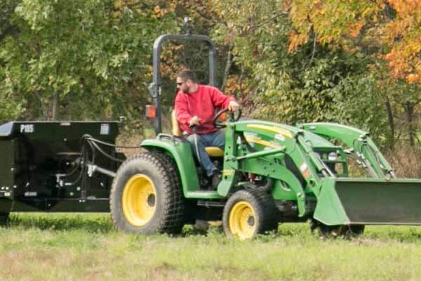 Manure Spreader PTO being used/pulled by a tractor user.