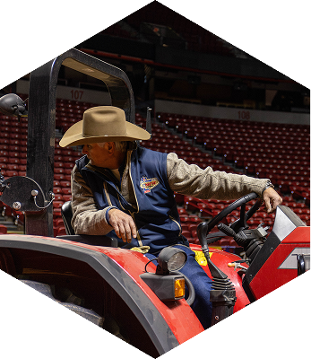 Randy Spraggins on a orange tractor.