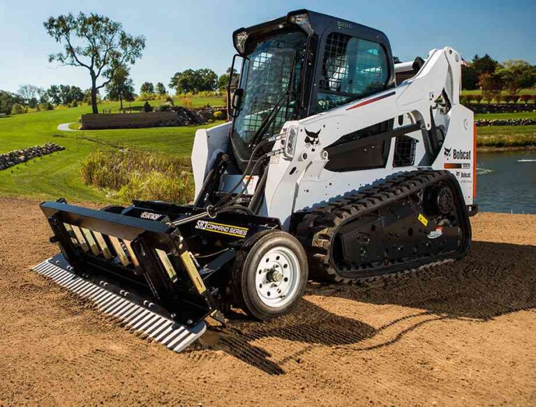 ABI Commercial Landscape Rake for landcapers and contractors being displayed by water and soil.