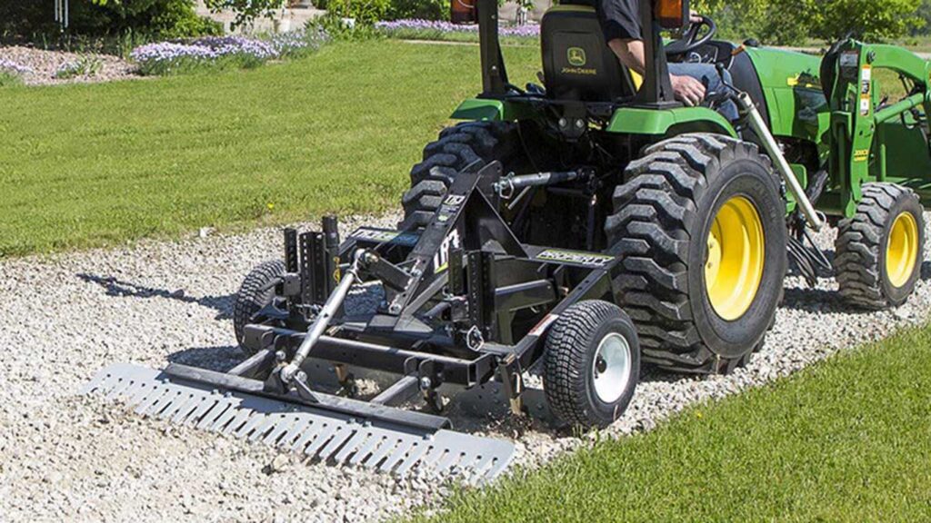 The TR3 (driveway grader) are being pulled/dragged by a tractor on gravel (perfect for gravel driveways and paths).
